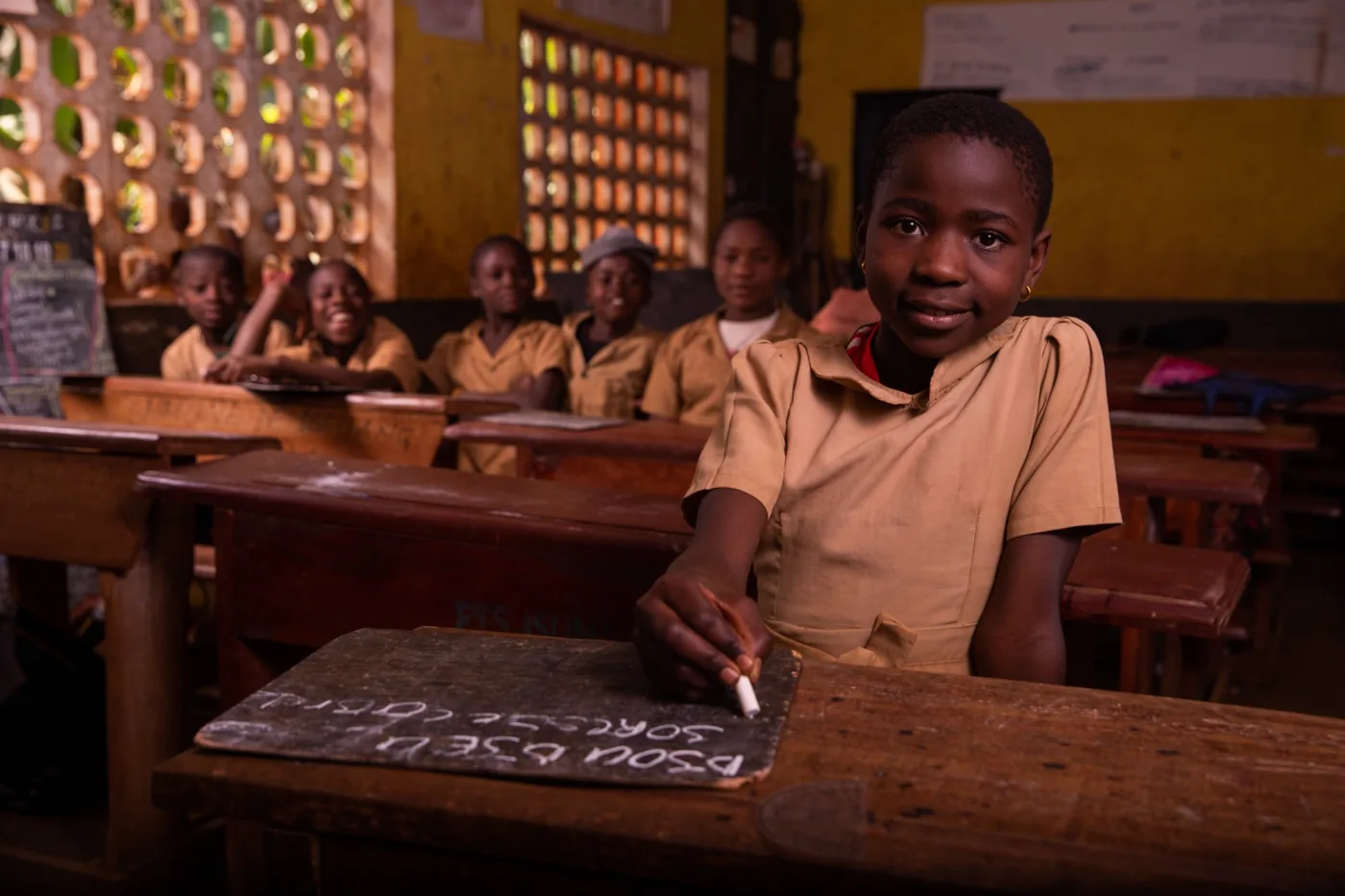 Pupil writing on a slate